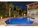An in-ground pool with an attached spa is centered in the backyard with an outdoor seating and dining area at 2211 Azalea Pl, Winter Park, FL 32789