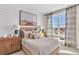 Inviting bedroom featuring a comfortable bed, beach-themed decor, and ample natural light at 2273 Valentine Aly, Orlando, FL 32804