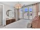 Serene bedroom showcasing a comfortable bed, warm-toned accents, and natural light from the windows at 2273 Valentine Aly, Orlando, FL 32804