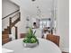 Bright dining area with a modern table, opening to a stylish kitchen and living space with contemporary finishes at 2273 Valentine Aly, Orlando, FL 32804