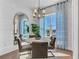 Elegant dining room with modern lighting and blue patterned curtains at 2273 Valentine Aly, Orlando, FL 32804