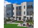 Modern townhome featuring manicured lawn, walkway, and a sleek architectural design at 2273 Valentine Aly, Orlando, FL 32804