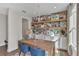 Home office features a stylish accent wall with shelves and a spacious wooden desk at 2273 Valentine Aly, Orlando, FL 32804