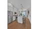 An inviting kitchen featuring stainless steel appliances and a central island with seating at 2273 Valentine Aly, Orlando, FL 32804