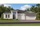 Charming single-story home with a three-car garage and a well-manicured lawn at 2299 Rider Rain Ln, Apopka, FL 32703