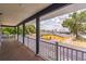 Spacious balcony featuring dark gray columns and a white railing at 2604 Marble Ave, Orlando, FL 32803