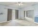Blue hued bedroom featuring sliding glass door to the patio and a mirrored closet at 2604 Marble Ave, Orlando, FL 32803