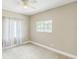 Bedroom featuring a ceiling fan and two windows offering ample natural lighting at 2604 Marble Ave, Orlando, FL 32803