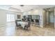 An elegant dining room offers ample space for dining featuring an island with barstool seating at 2604 Marble Ave, Orlando, FL 32803