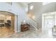 Grand foyer featuring high ceilings, tile flooring, staircase, and an open view into the living areas at 2604 Marble Ave, Orlando, FL 32803