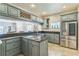 The kitchen is open to the Gathering room and features stainless appliances and lots of counter space at 2604 Marble Ave, Orlando, FL 32803