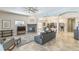 Large living area with stone fireplace, tile flooring, and abundant natural light at 2604 Marble Ave, Orlando, FL 32803