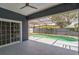 An inviting screened-in pool area offers a relaxing space for outdoor enjoyment and entertaining at 2604 Marble Ave, Orlando, FL 32803