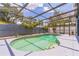 Enclosed pool area showcasing a refreshing pool, spacious deck, and secure surroundings at 2604 Marble Ave, Orlando, FL 32803