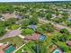 Beautiful aerial view showcasing a neighborhood with lush green landscaping and mature trees at 3 Pine Glen Dr, Debary, FL 32713