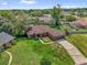 Aerial view showcases the home with mature trees, lush backyard, and well maintained lawn at 3 Pine Glen Dr, Debary, FL 32713