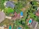 A high definition overhead shot shows a home with a large swimming pool at 3 Pine Glen Dr, Debary, FL 32713