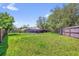Spacious backyard with a well-maintained lawn, providing ample space for outdoor activities and landscaping opportunities at 3 Pine Glen Dr, Debary, FL 32713