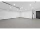Large two car garage with epoxy floors and access door to the backyard at 3 Pine Glen Dr, Debary, FL 32713