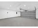 Spacious two car garage with epoxy floors and an automatic door at 3 Pine Glen Dr, Debary, FL 32713