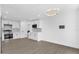 Open kitchen area featuring recessed lighting, white cabinets and stainless-steel appliances at 3 Pine Glen Dr, Debary, FL 32713