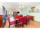 Dining area with a chandelier and views of the living area at 30308 Cheval St, Mount Dora, FL 32757