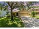Charming single-Gathering home features a well-manicured lawn and a two-car garage at 30308 Cheval St, Mount Dora, FL 32757