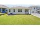 Well-maintained backyard with lush green grass and a modern outdoor area featuring a patio, perfect for outdoor living at 3142 Hill Point St, Minneola, FL 34715