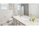 Bathroom featuring a framed mirror, framed art, and a single sink at 3142 Hill Point St, Minneola, FL 34715