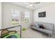 Bedroom with a ceiling fan, a futon, two windows and trampoline at 3142 Hill Point St, Minneola, FL 34715