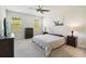 Comfortable bedroom with two windows, carpeted floors, and neutral paint that offers a relaxing space at 3142 Hill Point St, Minneola, FL 34715