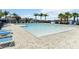 Large community pool with ample lounge chairs and clear blue water, perfect for relaxing and enjoying the outdoors at 3142 Hill Point St, Minneola, FL 34715