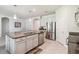 Modern kitchen features granite countertops, stainless steel appliances, and stylish pendant lighting at 3142 Hill Point St, Minneola, FL 34715