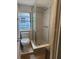 Bathroom featuring an enclosed glass shower with modern fixtures and a tiled floor at 3629 Main St, Sanford, FL 32771