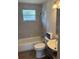Cozy bathroom with a shower-tub combination, tiled walls, and a modern vanity at 3629 Main St, Sanford, FL 32771