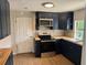 Well-lit kitchen featuring wood countertops, navy cabinets, and stainless steel appliances at 3629 Main St, Sanford, FL 32771