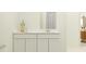 Bathroom featuring a white vanity with a quartz countertop and modern fixtures at 431 Puma Loop, Groveland, FL 34736