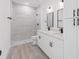 Bathroom featuring double sinks, sleek fixtures, and a spacious shower at 4572 Sw 149Th St, Ocala, FL 34473