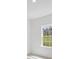 Bright bedroom with a window view offering natural light and neutral-toned walls at 4572 Sw 149Th St, Ocala, FL 34473
