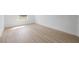 Well-lit room featuring sleek wood-look flooring, blank canvas for personalization at 4572 Sw 149Th St, Ocala, FL 34473