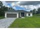 Charming single-story home featuring a two-car garage, neutral paint scheme, and meticulously landscaped front yard at 4572 Sw 149Th St, Ocala, FL 34473