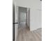 Hallway showing white doors and baseboards, and neutral walls at 4572 Sw 149Th St, Ocala, FL 34473