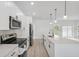 Bright kitchen featuring new appliances, ample counter space, and seamless access to the outdoors at 4572 Sw 149Th St, Ocala, FL 34473