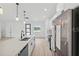 Modern kitchen featuring stainless steel appliances, quartz countertops, and a central kitchen island at 4572 Sw 149Th St, Ocala, FL 34473