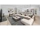 Modern living room boasts an open layout, stylish furniture and decor at 4572 Sw 149Th St, Ocala, FL 34473