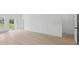 Bright living room features light wood flooring and natural light at 4572 Sw 149Th St, Ocala, FL 34473