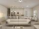 Modern living room with sleek lighting, a stainless kitchen, and comfortable lounge seating at 4572 Sw 149Th St, Ocala, FL 34473