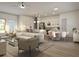 Open-concept living area showcasing modern decor, a stylish kitchen, and comfortable seating at 4572 Sw 149Th St, Ocala, FL 34473