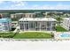 Aerial view showcases the waterfront condominium, pool, spa and tennis courts at 4631 S Atlantic Ave # 8102, Port Orange, FL 32127