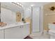 Bright bathroom featuring a clear glass shower and a sink at 4631 S Atlantic Ave # 8102, Port Orange, FL 32127
